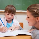 teacher helping student with adhd